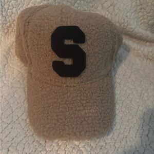 Cozy Tan Cap with Black Letter “S”